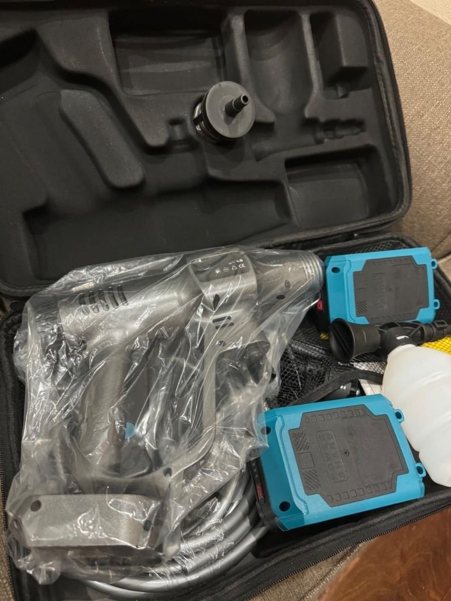 Pressure washer cleaning car